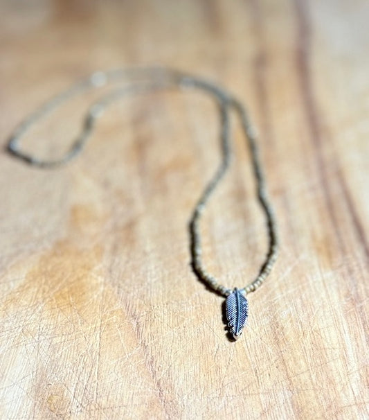Speckled Beige Stretchy Seed Bead Necklace with Silver-Plated Feather Charm