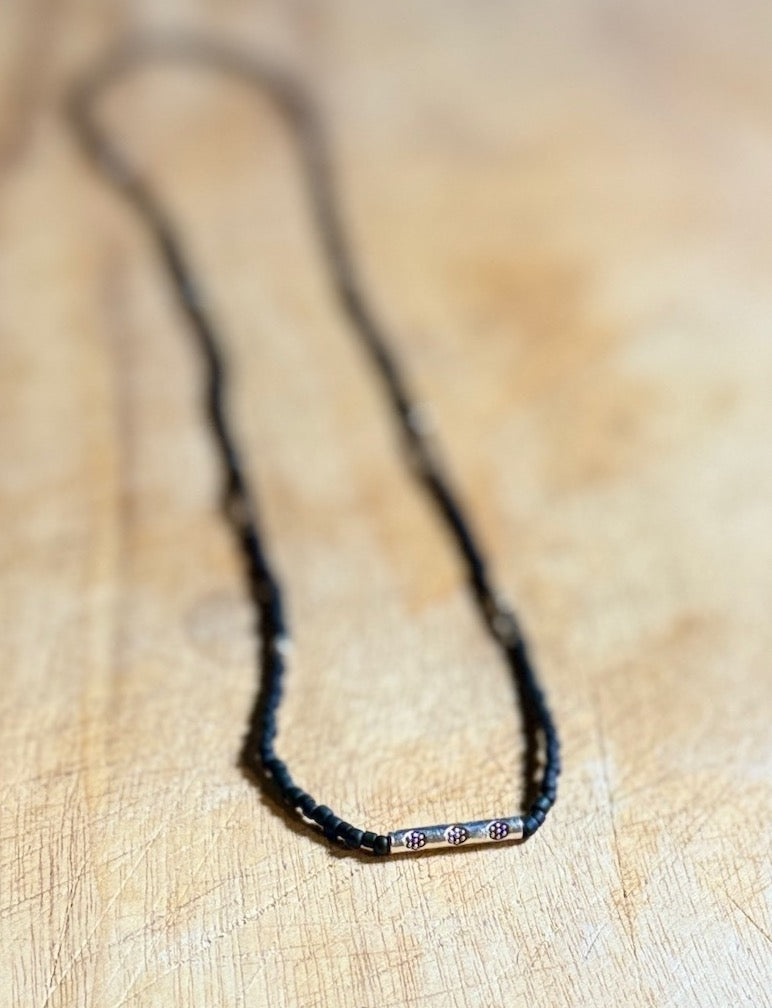 Black Stretchy Seed Bead Necklace with Rounded Silver Floral Stamped Charm