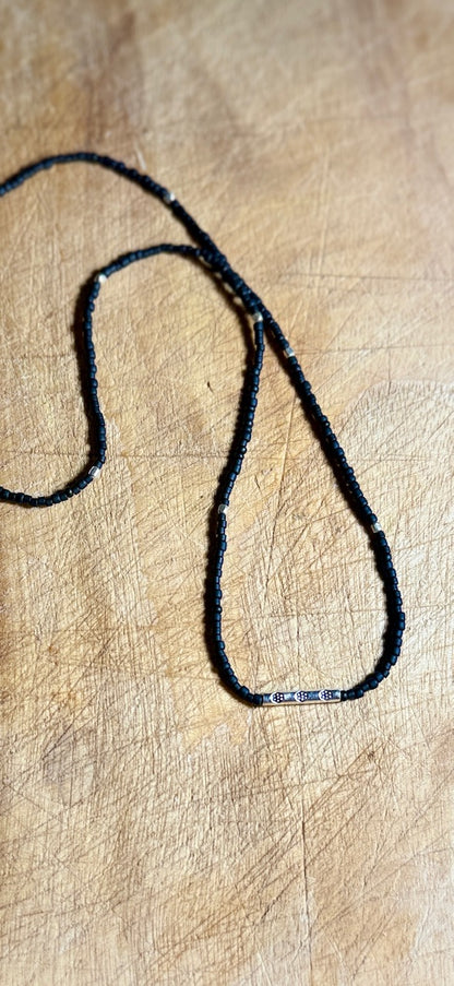 Black Stretchy Seed Bead Necklace with Rounded Silver Floral Stamped Charm