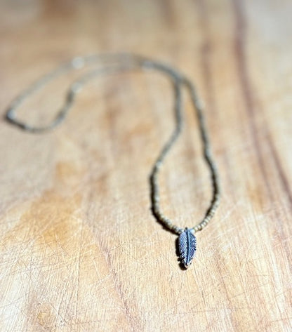 Speckled Beige Stretchy Seed Bead Necklace with Silver-Plated Feather Charm