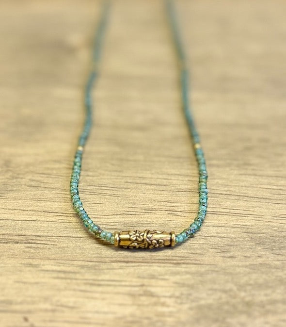 Speckled Green Stretchy Seed Bead Necklace with Gold-Plated Floral Barrel Bead Charm