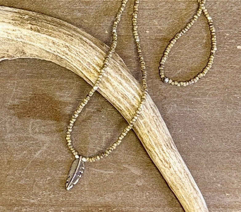 Speckled Beige Stretchy Seed Bead Necklace with Silver-Plated Feather Charm