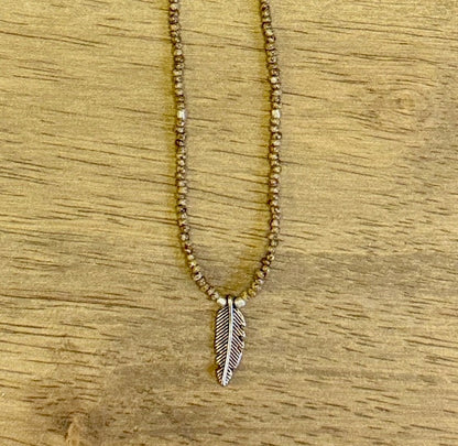 Speckled Beige Stretchy Seed Bead Necklace with Silver-Plated Feather Charm