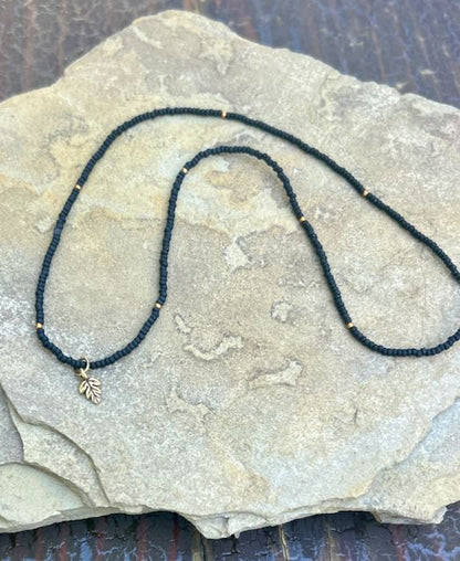 Jet Black & Gold Leaf Stretchy Seed Bead Pendant Necklace