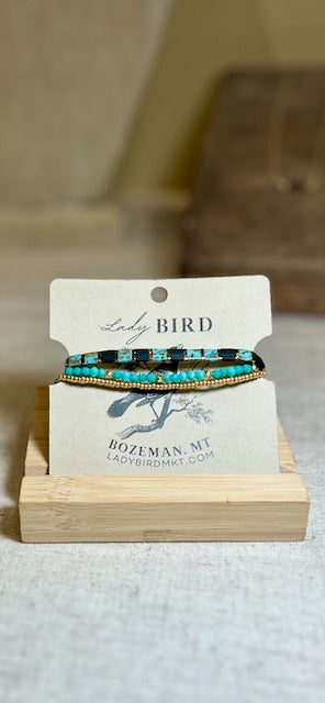 Black & Vibrant Turquoise Tila Bead Stacked Bracelet Set