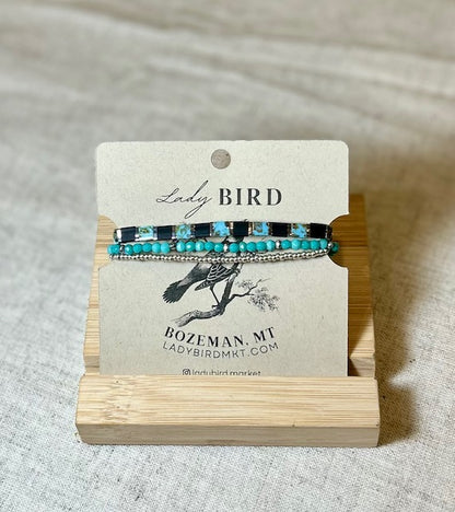 Black & Vibrant Turquoise Tila Bead Stacked Bracelet Set