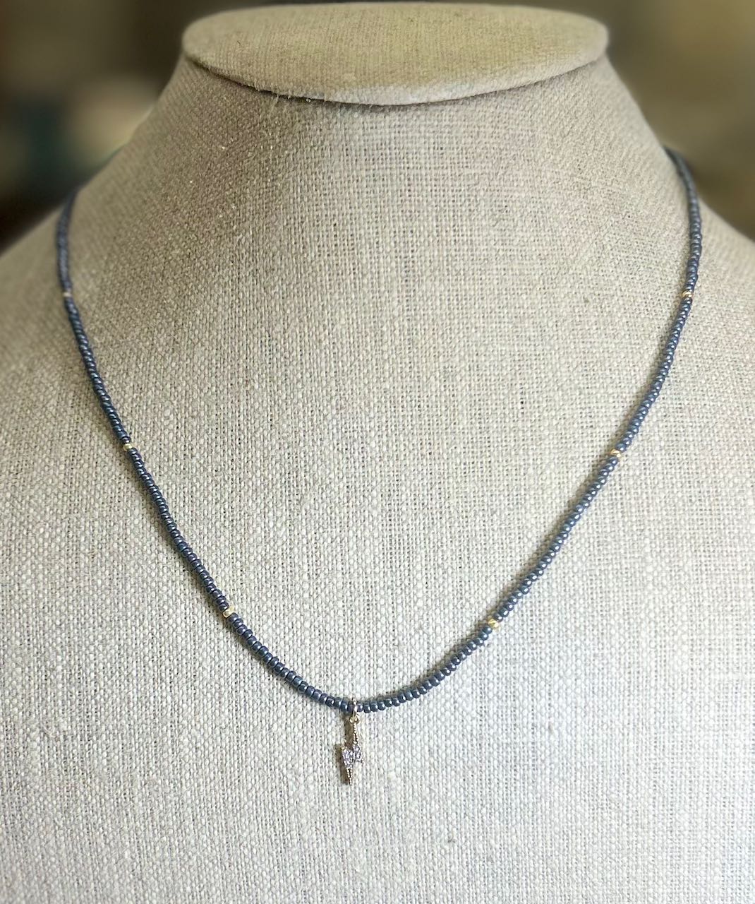 Steel Gray Boho Beaded Necklace with Gold Lightning Bolt Charm