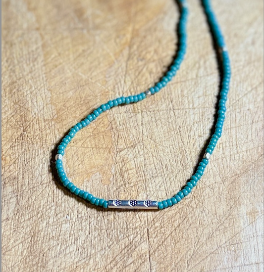 Eucalyptus Green Stretchy Seed Bead Necklace with Rounded Silver Floral Stamped Charm