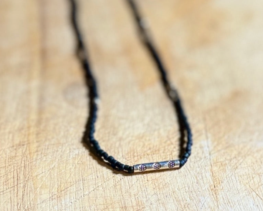 Black Stretchy Seed Bead Necklace with Rounded Silver Floral Stamped Charm