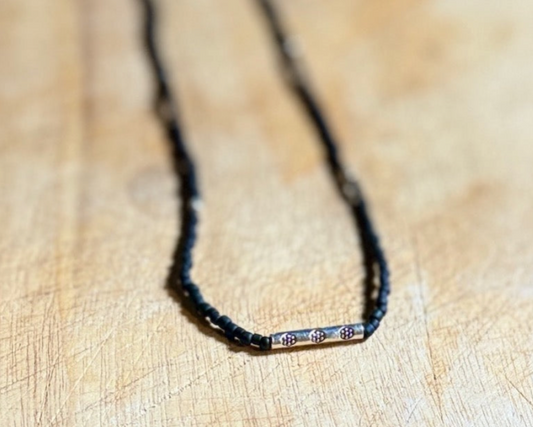 Black Stretchy Seed Bead Necklace with Rounded Silver Floral Stamped Charm