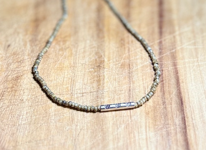 Speckled Beige Stretchy Seed Bead Necklace with Rounded Silver Floral Stamped Charm